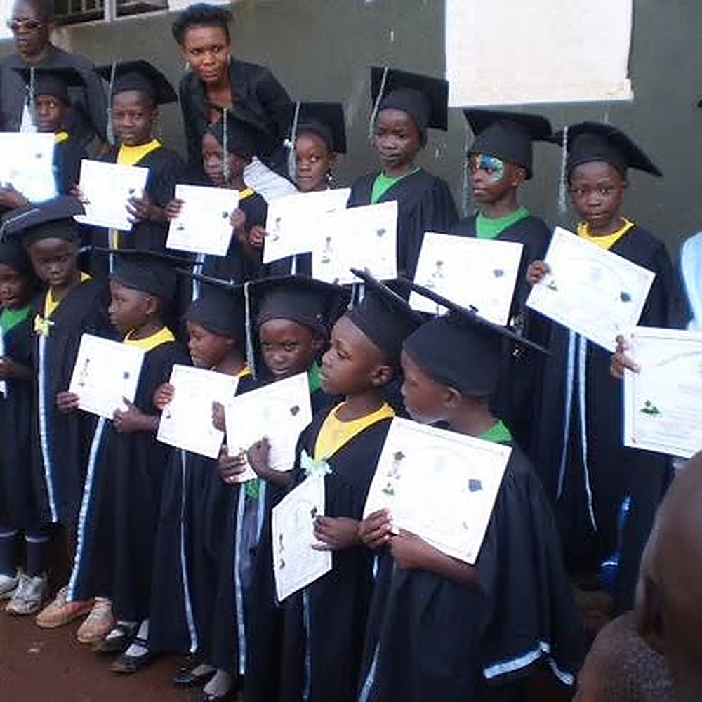 Nursery graduates in caps and gowns at YAEC