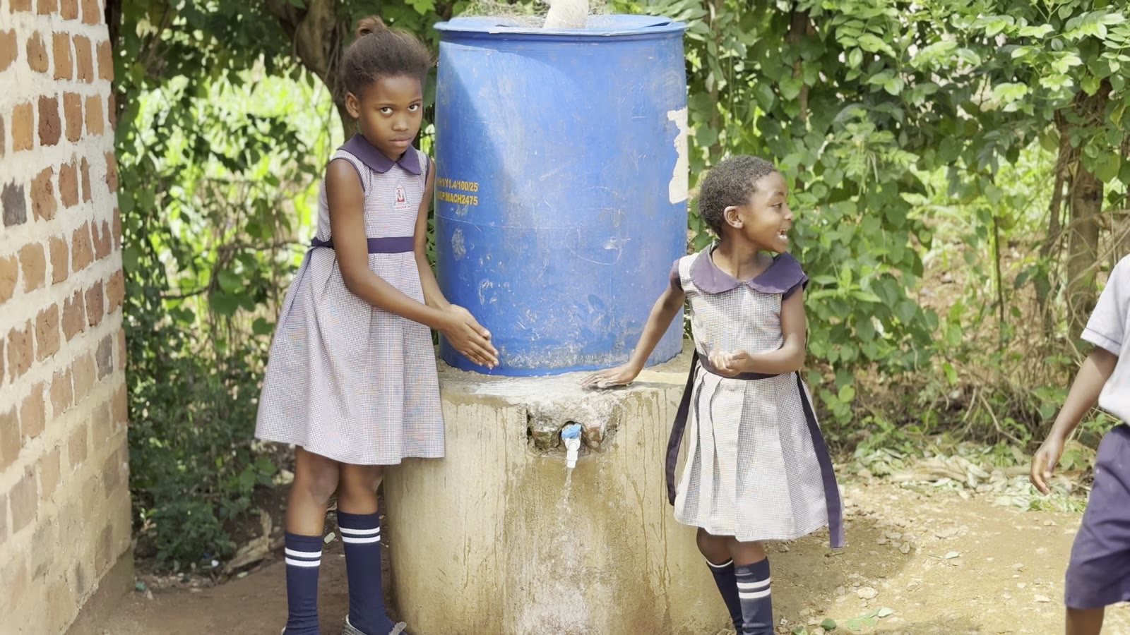 Washing hands at the new rainwater tank