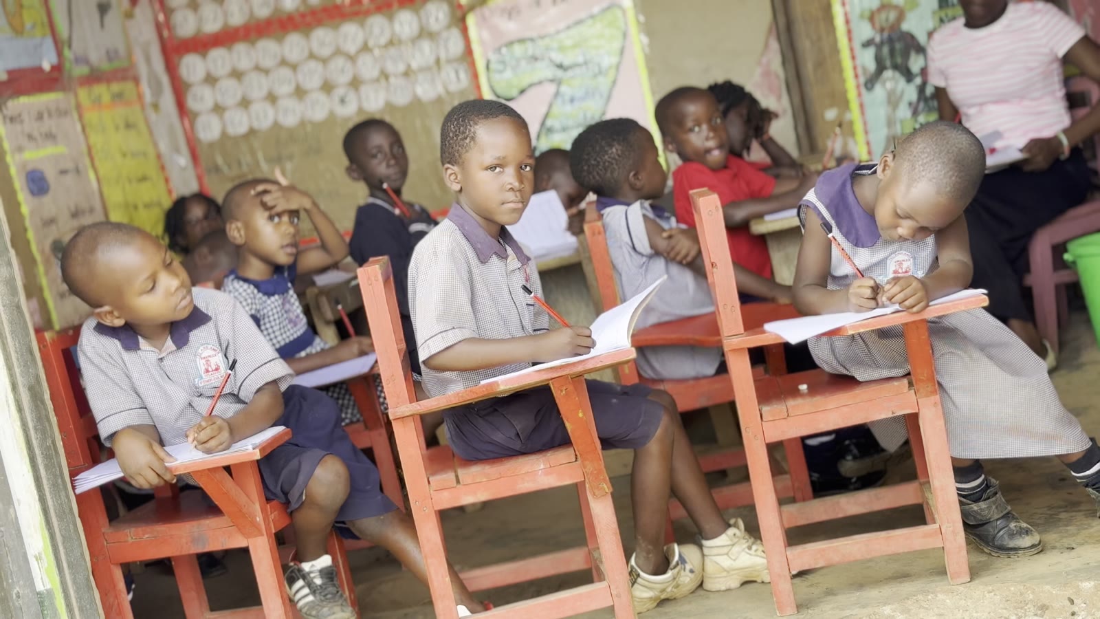 Nursery pupils at their writing