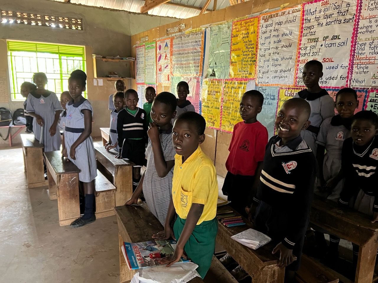 Smiling upper primary pupils in their classroom
